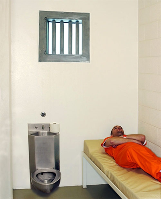 Creasey in his cell, moments after receiving his most recent notice from the court.